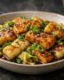 Golden tofu and crispy rice cakes in glossy scallion sesame sauce