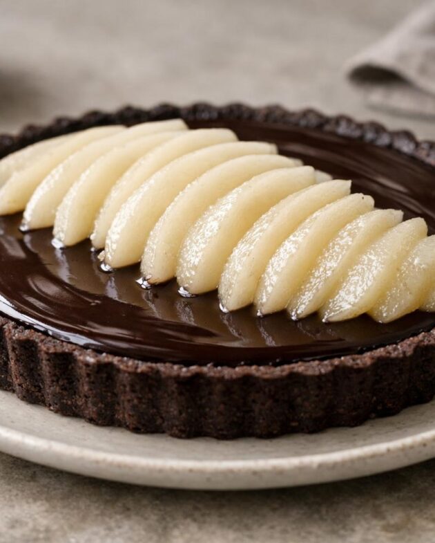 Chocolate pear tart with fanned poached pears
